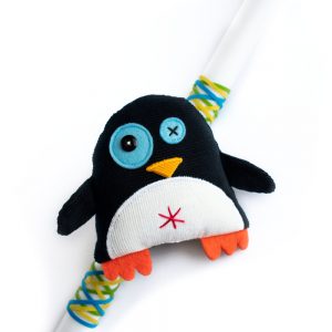 easter candle with penguin toy